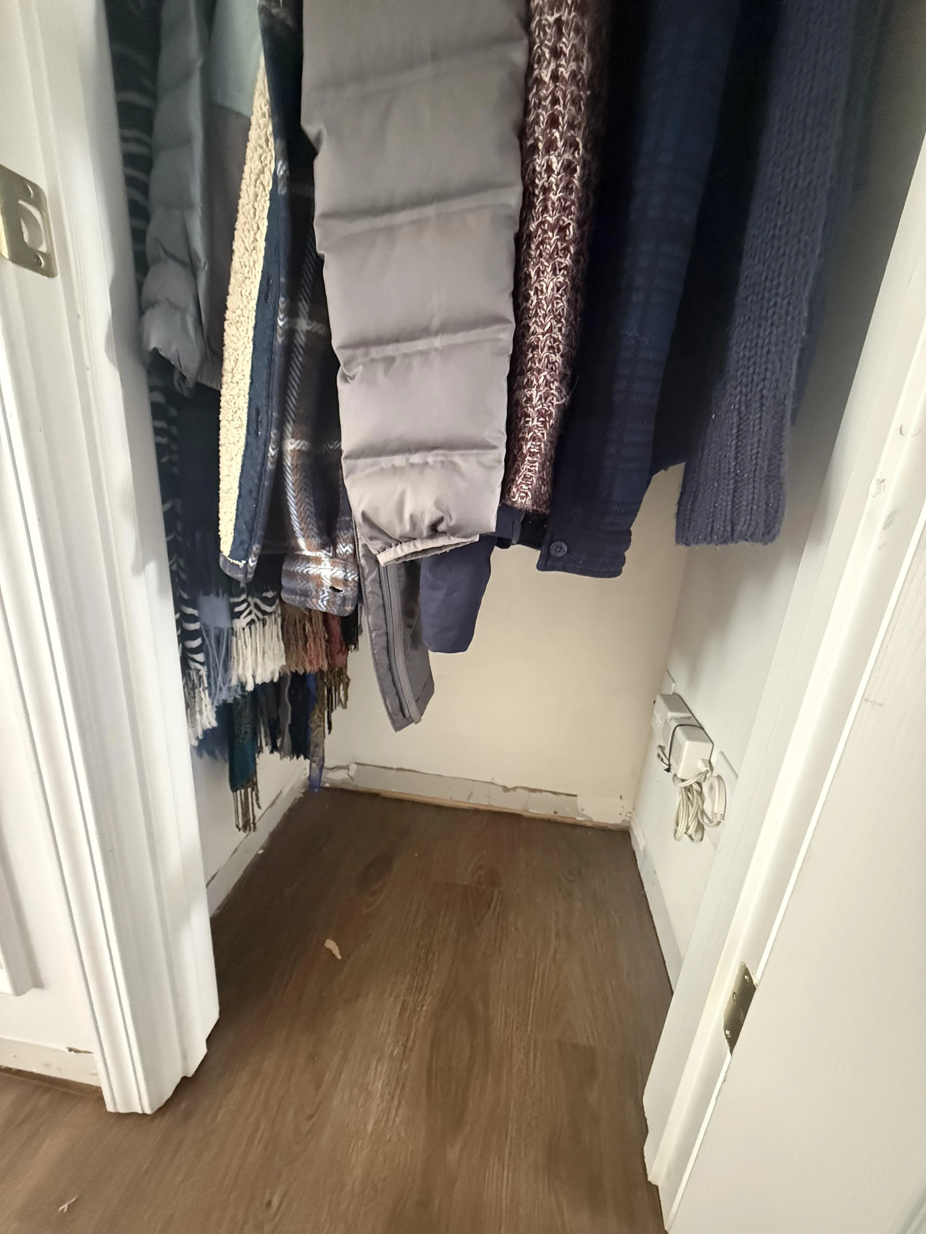 A finished hallway with new flooring and trim after a Carolina Pro Restoration rebuild