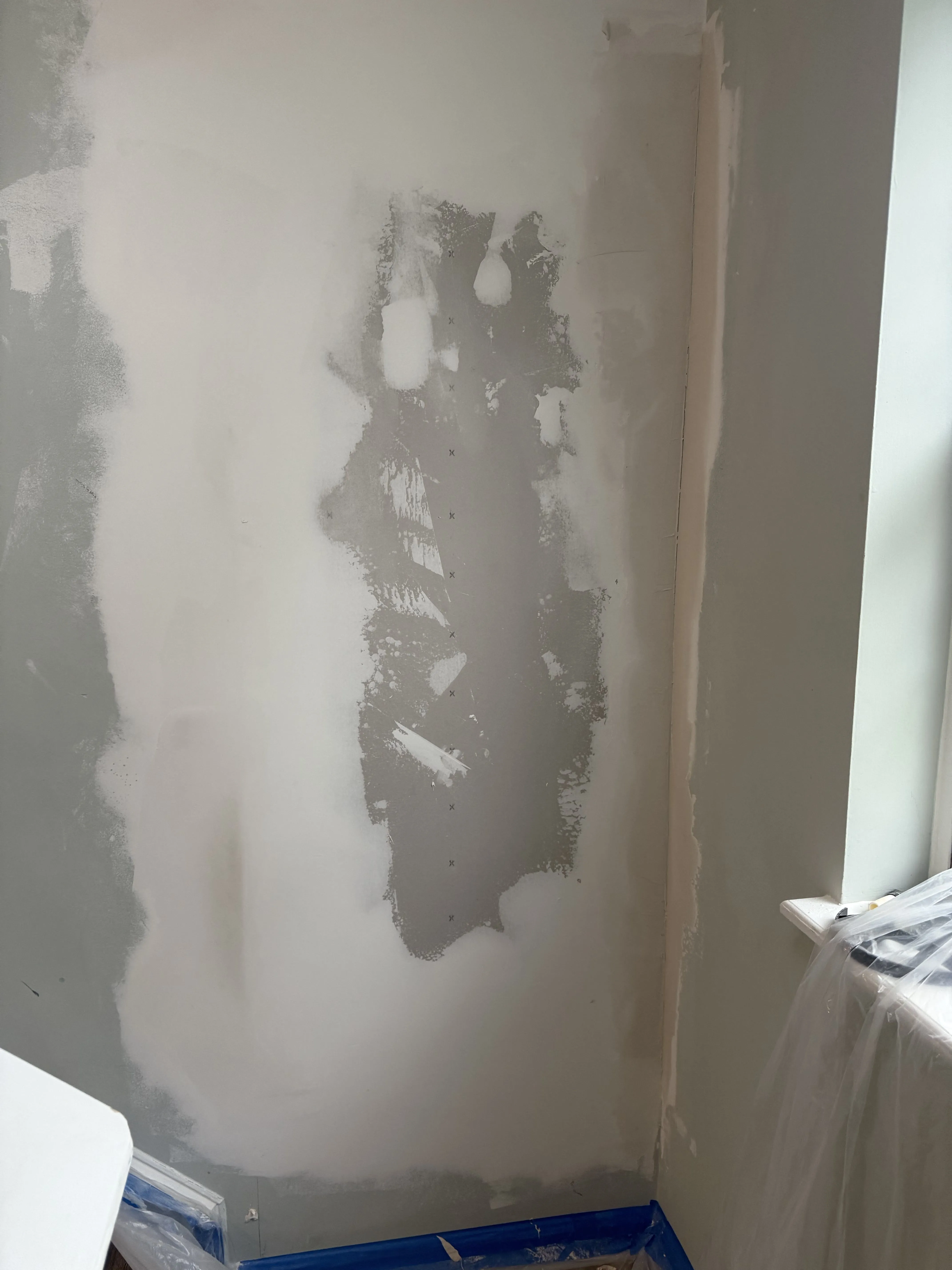 A drywall patch taped and coated with joint compound during a Carolina Pro Restoration repair