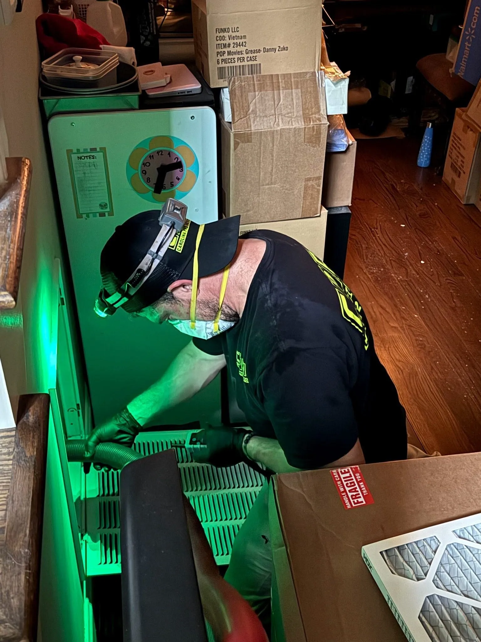 Technician cleaning HVAC ductwork