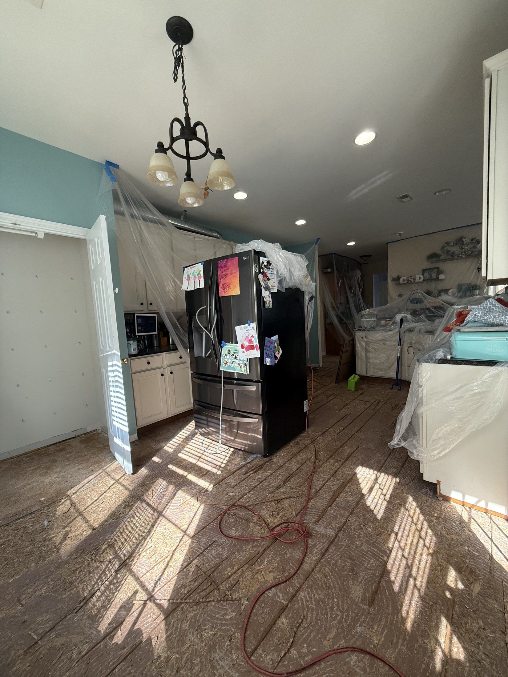 Water-damaged flooring torn out to the subfloor during a Carolina Pro Restoration job